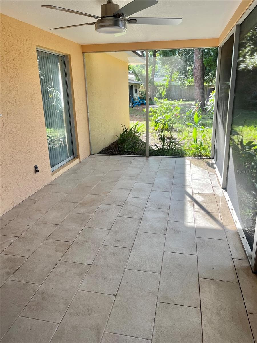 Screened in Back Porch - 2080 SUN TREE CIR N, CLEARWATER