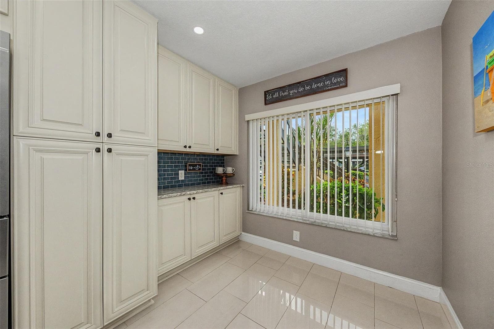 Kitchen with pantry cabinet and pull-out drawers - 1801 E LAKE RD #1D, PALM HARBOR
