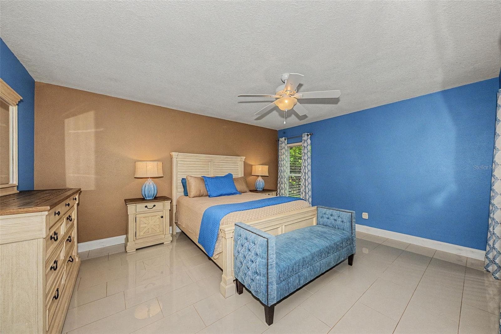 Primary Bedroom w/porcenlain tile - 1801 E LAKE RD #1D, PALM HARBOR