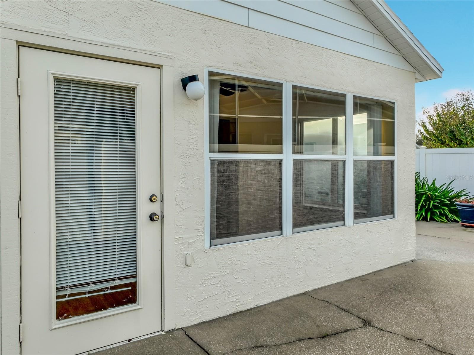 Back door from sunroom to patio. - 2038 BRAXTON ST, CLERMONT
