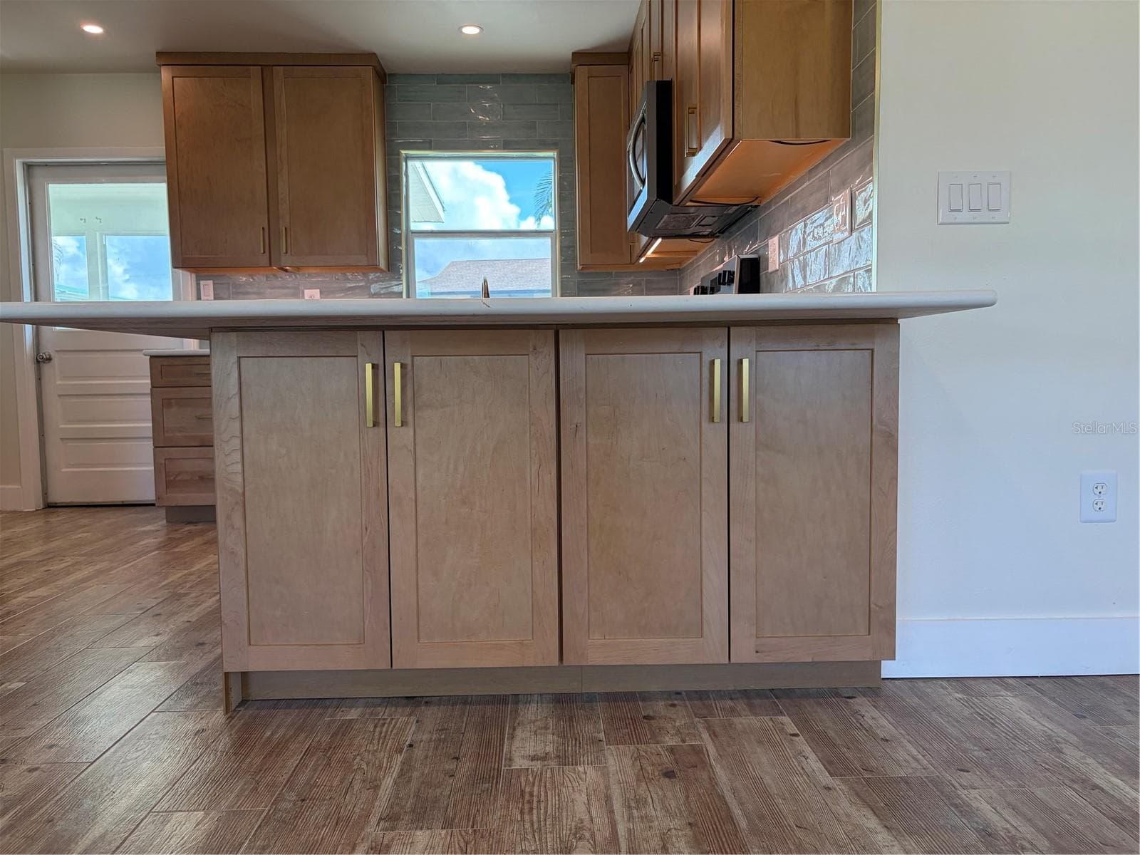 Updated kitchen peninsula with cabinet storage - 10451 MARION ST, ENGLEWOOD