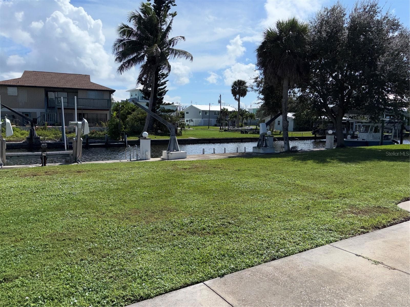 View of the backyard and saltwater canal - 10451 MARION ST, ENGLEWOOD
