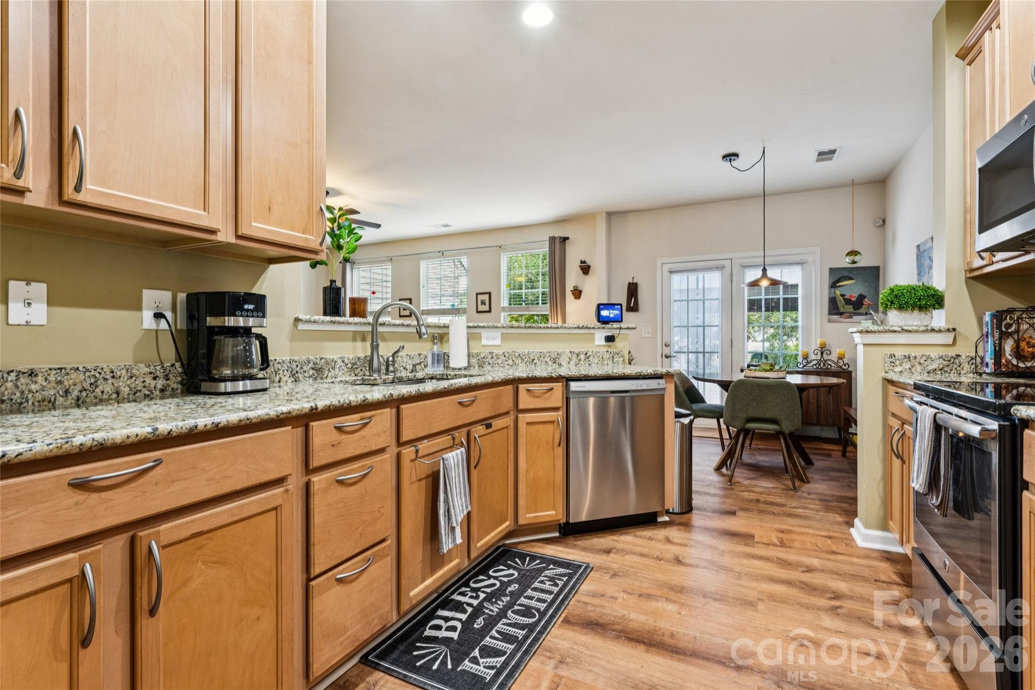Galley-style kitchen with granite countertops - 9506 Birkwood Court, Charlotte