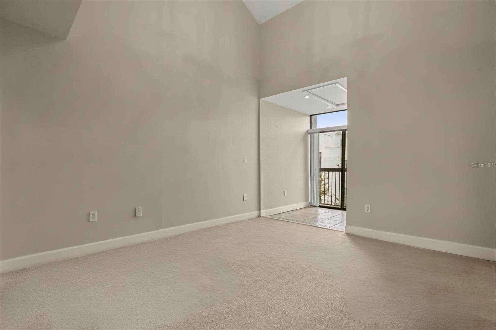 The 2nd bedroom includes its own sunroom with a Juliette balcony and vaulted ceilings to add to the openness. To make maximum use of the vaulted ceilings, an attic storage space was added over the sunroom with approximately 85 square feet of storage space, including shelving and electricity. - 300 CAROLINA AVE #402C, WINTER PARK