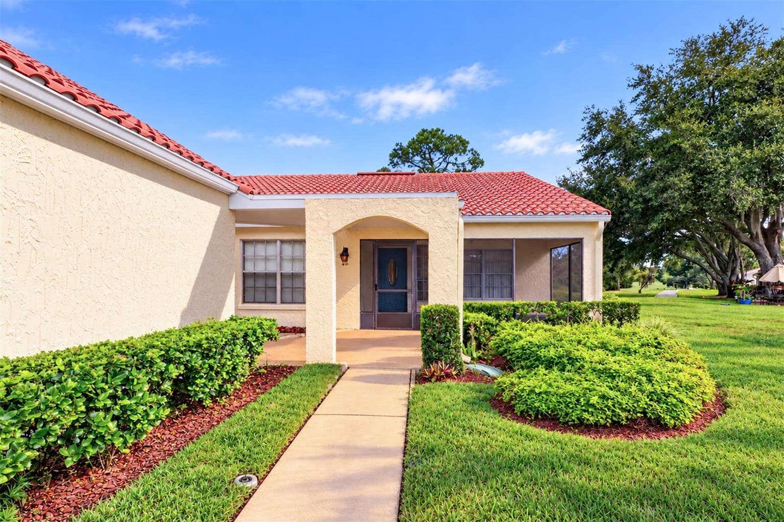 Walkway to the front door from the driveway - 978 MADRID DR, PALM HARBOR