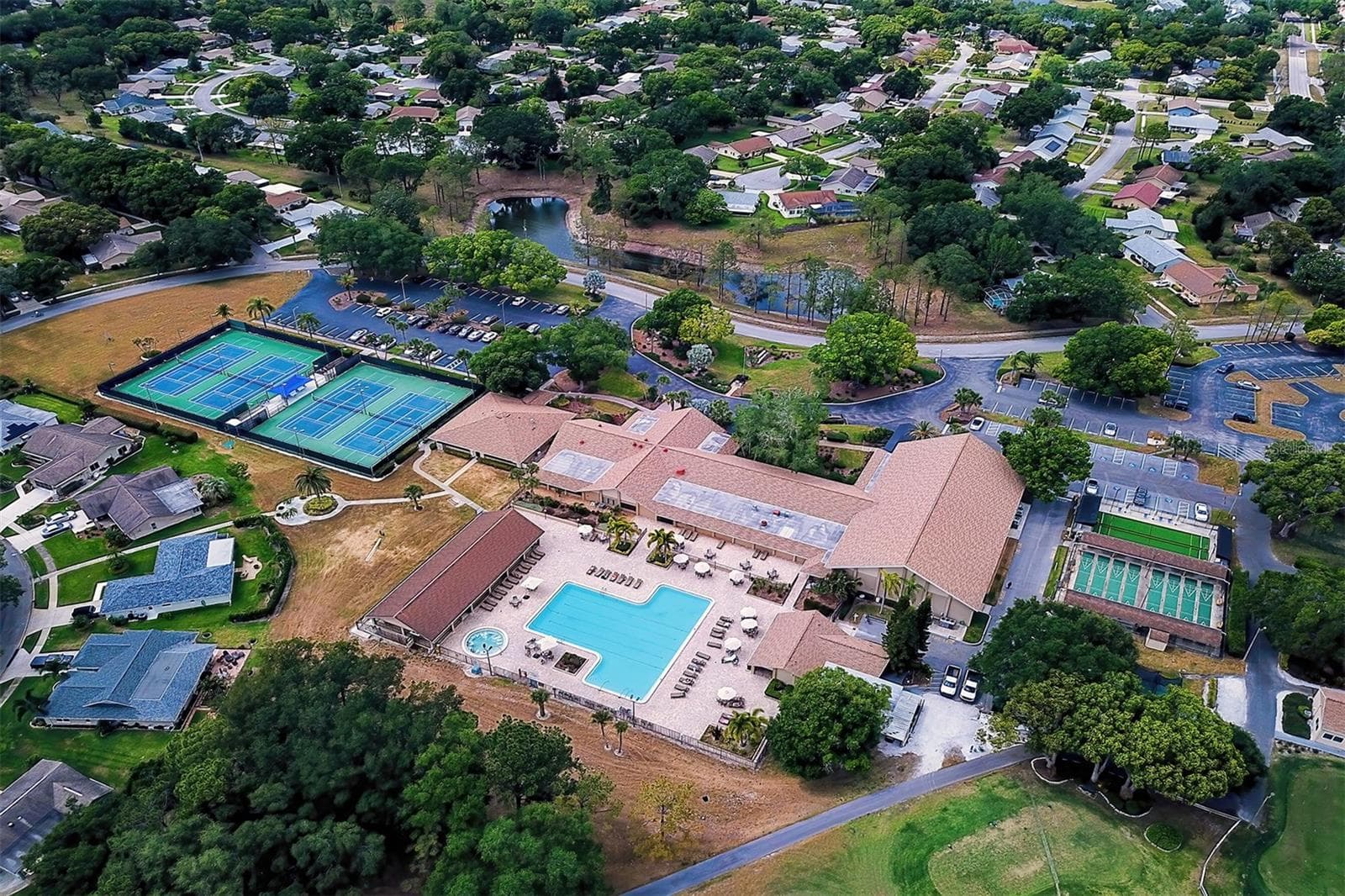 Rear view of the clubhouse and recreational faclities - 978 MADRID DR, PALM HARBOR