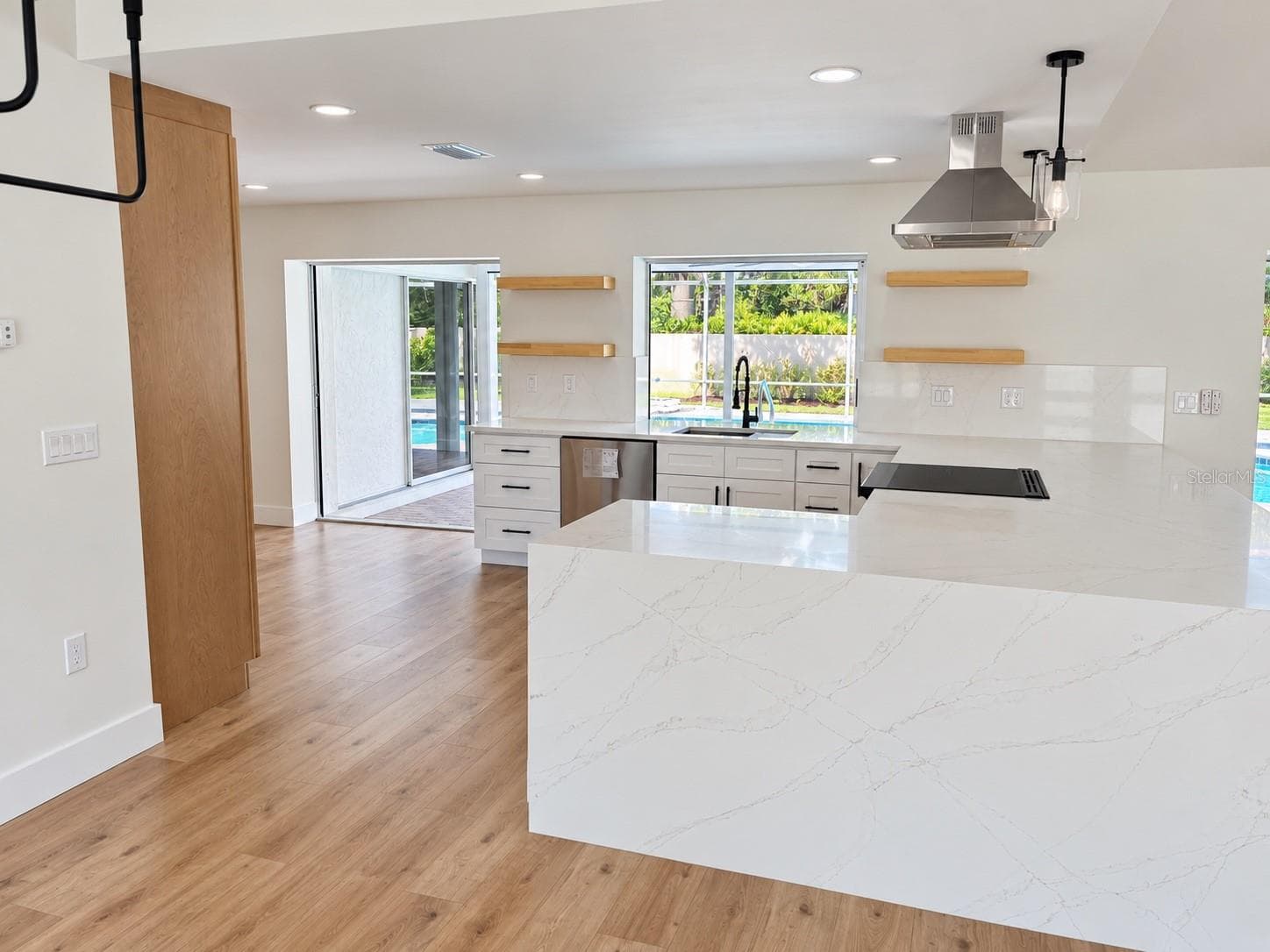 Kitchen with illuminated shelving - 102 WINDWARD DR, OSPREY