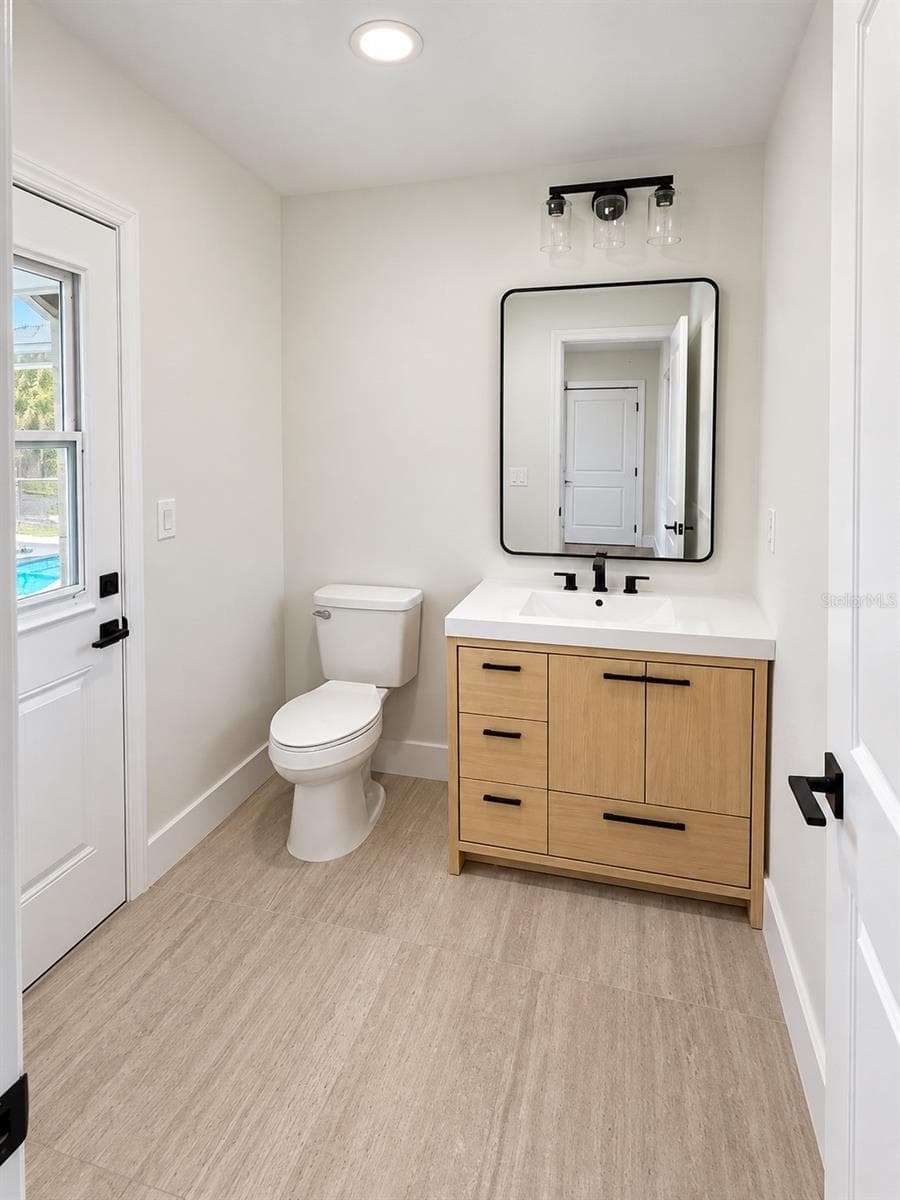 Half bathroom with exterior access - 102 WINDWARD DR, OSPREY