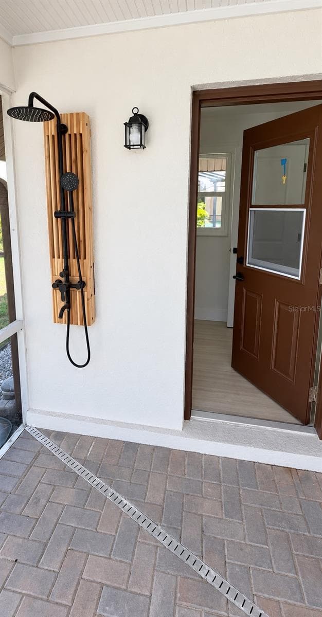 Outdoor shower beside the pool area - 102 WINDWARD DR, OSPREY