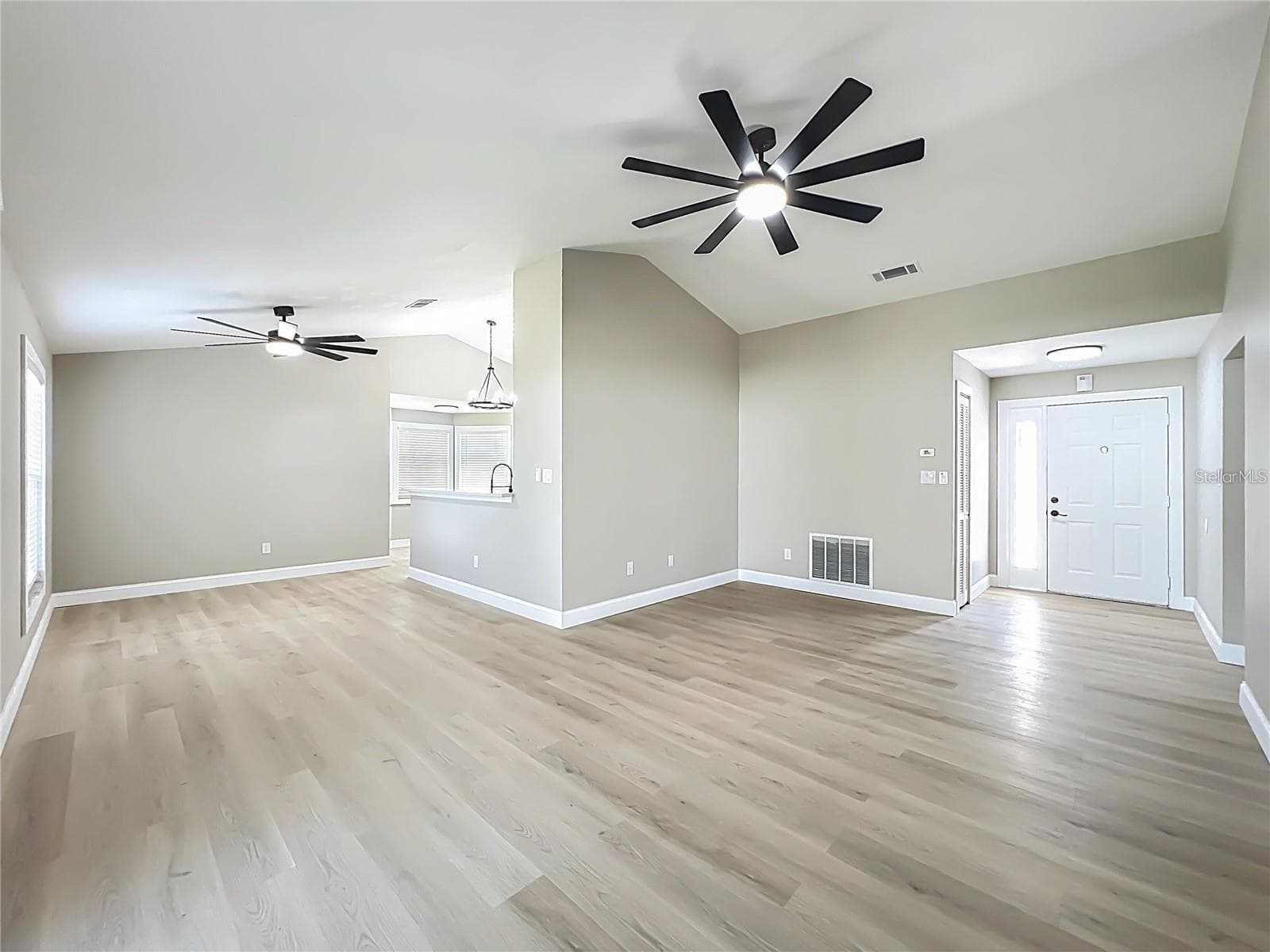 View of entrance, living room and dining area. - 6911 CRESCENT RIDGE RD, ORLANDO