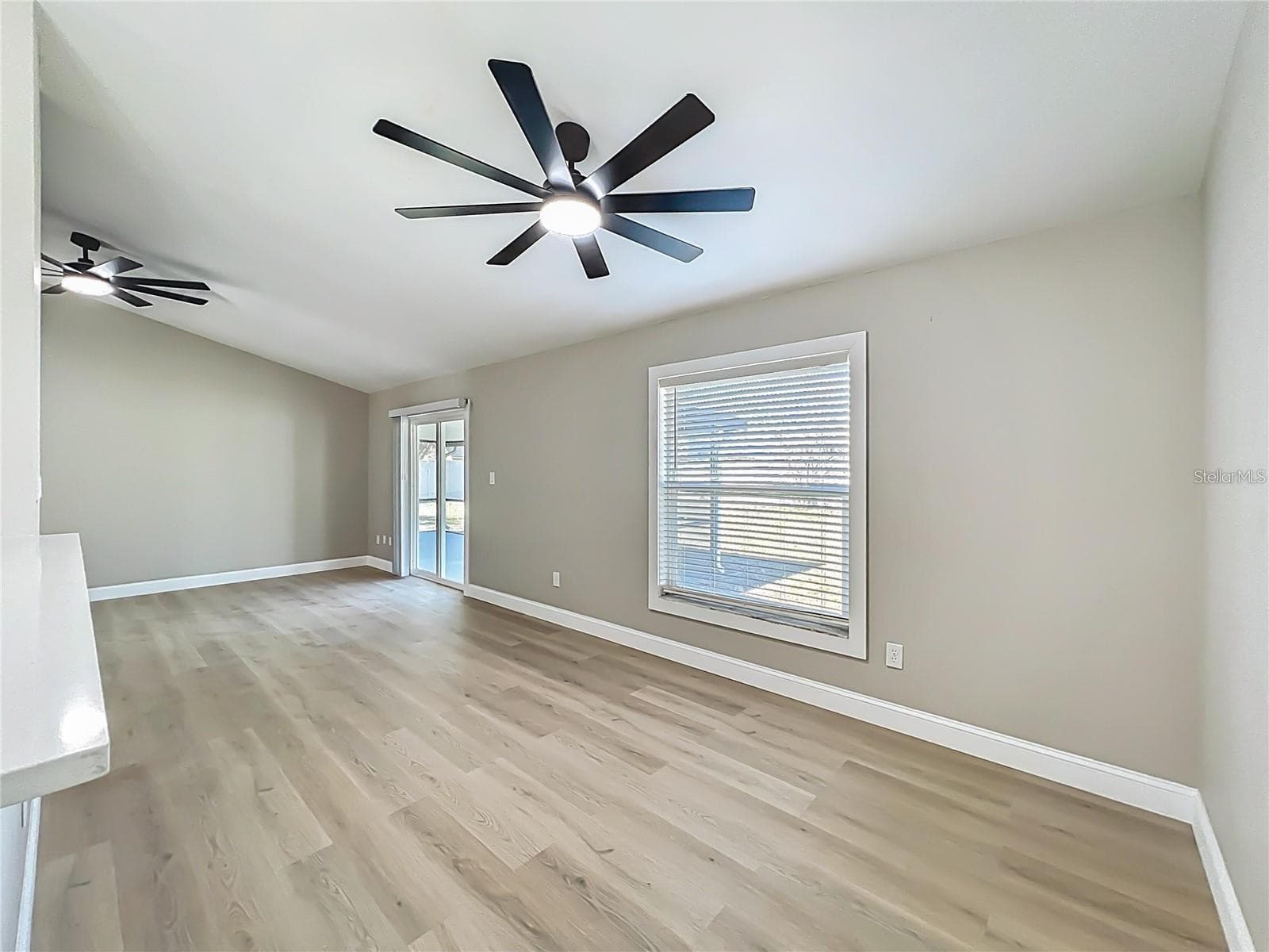View from kitchen, dining area, sliding doors toward back yard. - 6911 CRESCENT RIDGE RD, ORLANDO