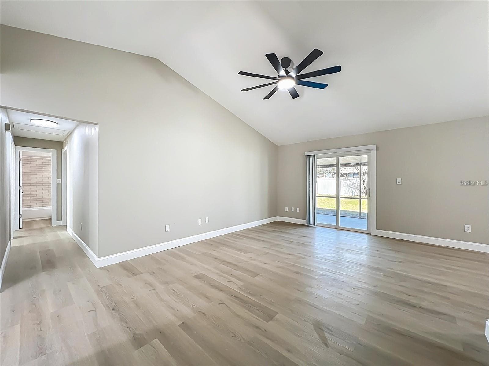 View from living room, sliding doors toward breezeway. - 6911 CRESCENT RIDGE RD, ORLANDO