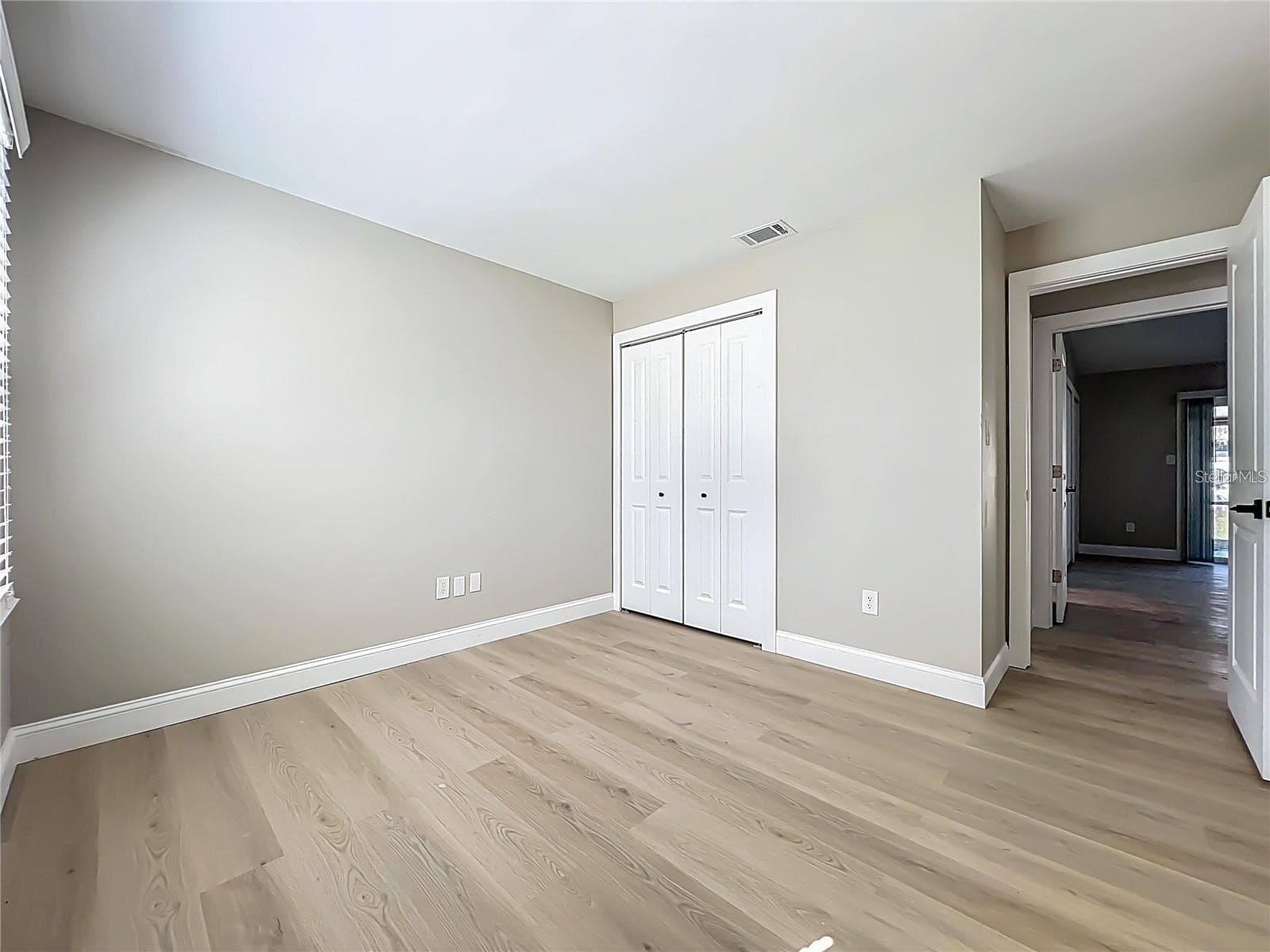 View of bedroom one, toward entrance and closet. - 6911 CRESCENT RIDGE RD, ORLANDO