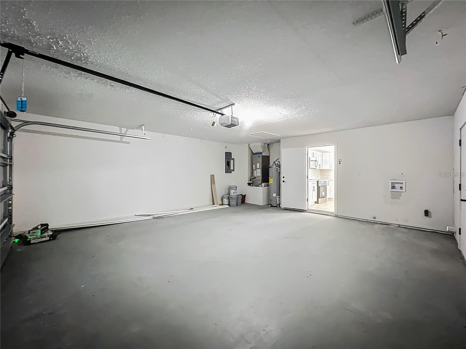 View from entrance of garage toward kitchen. - 6911 CRESCENT RIDGE RD, ORLANDO