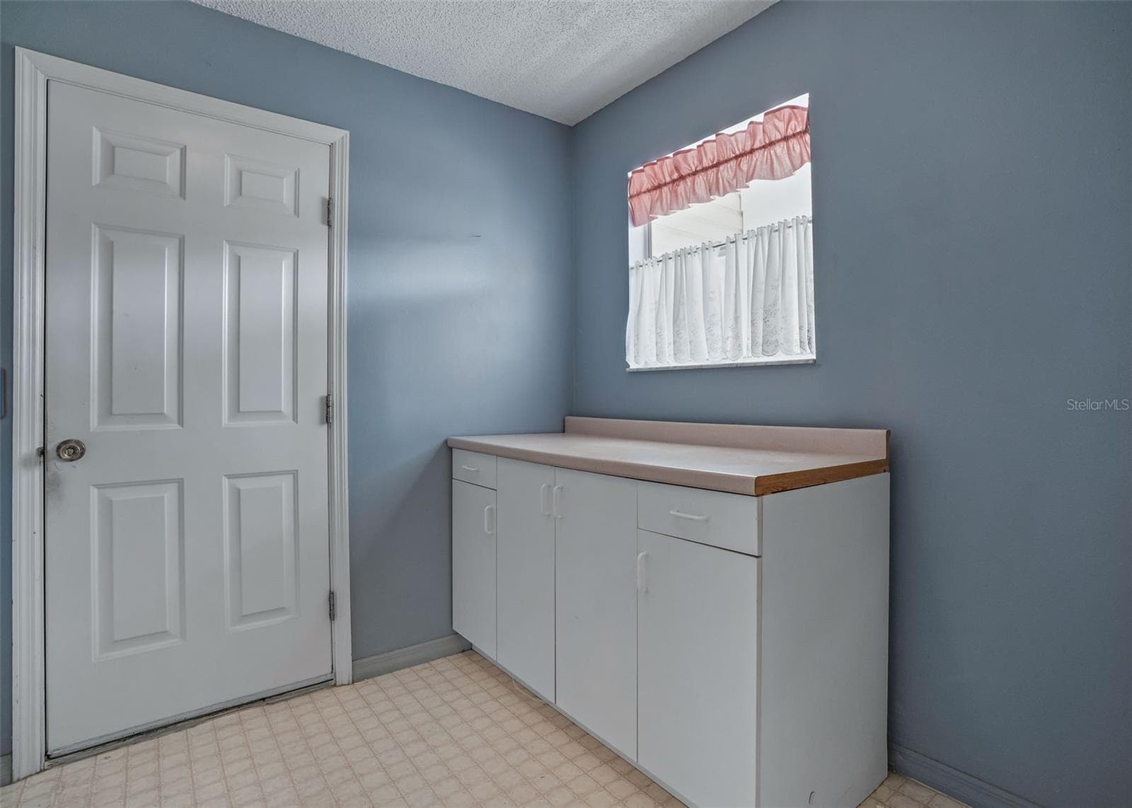 Laundry Room leading to the garage - 930 RAMOS DR, THE VILLAGES