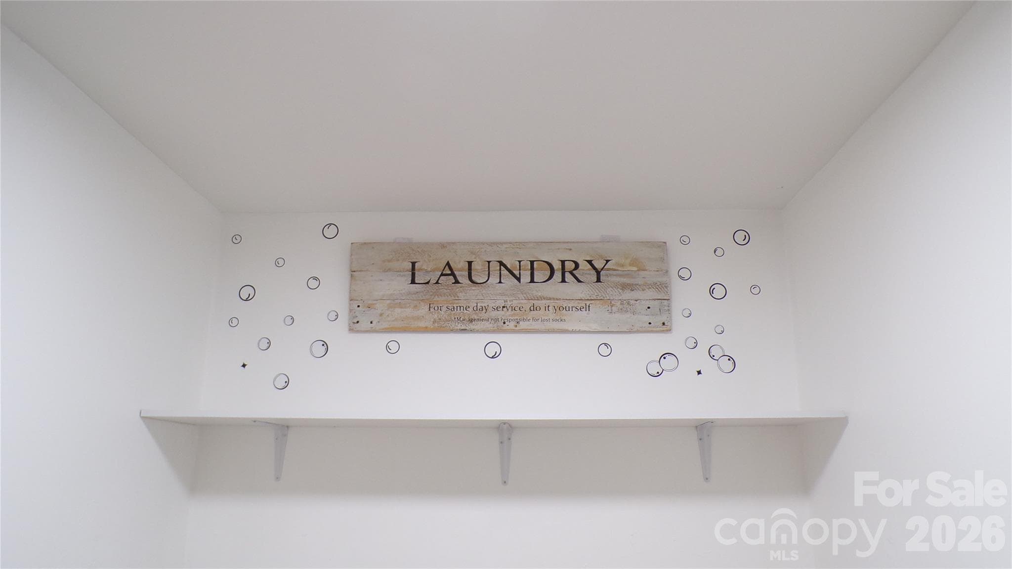 Laundry in half bath - 5504 Ilford Street, Charlotte