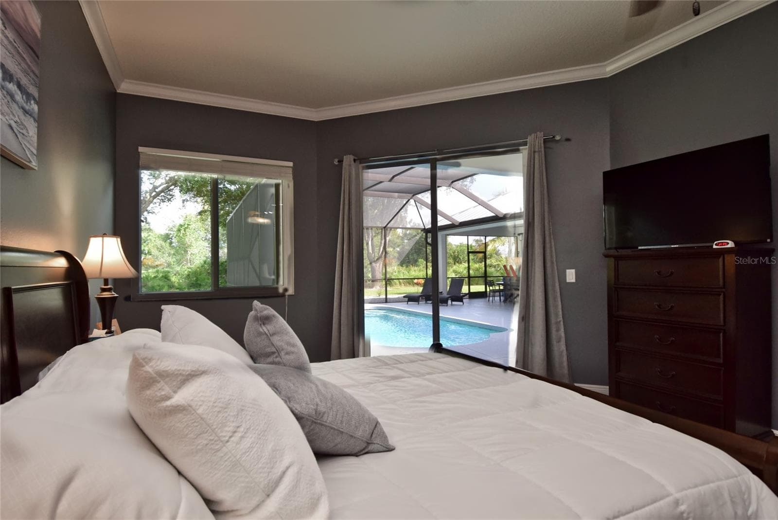 Primary bedroom and pool access - 8309 MISTY LAKE CIR, SARASOTA