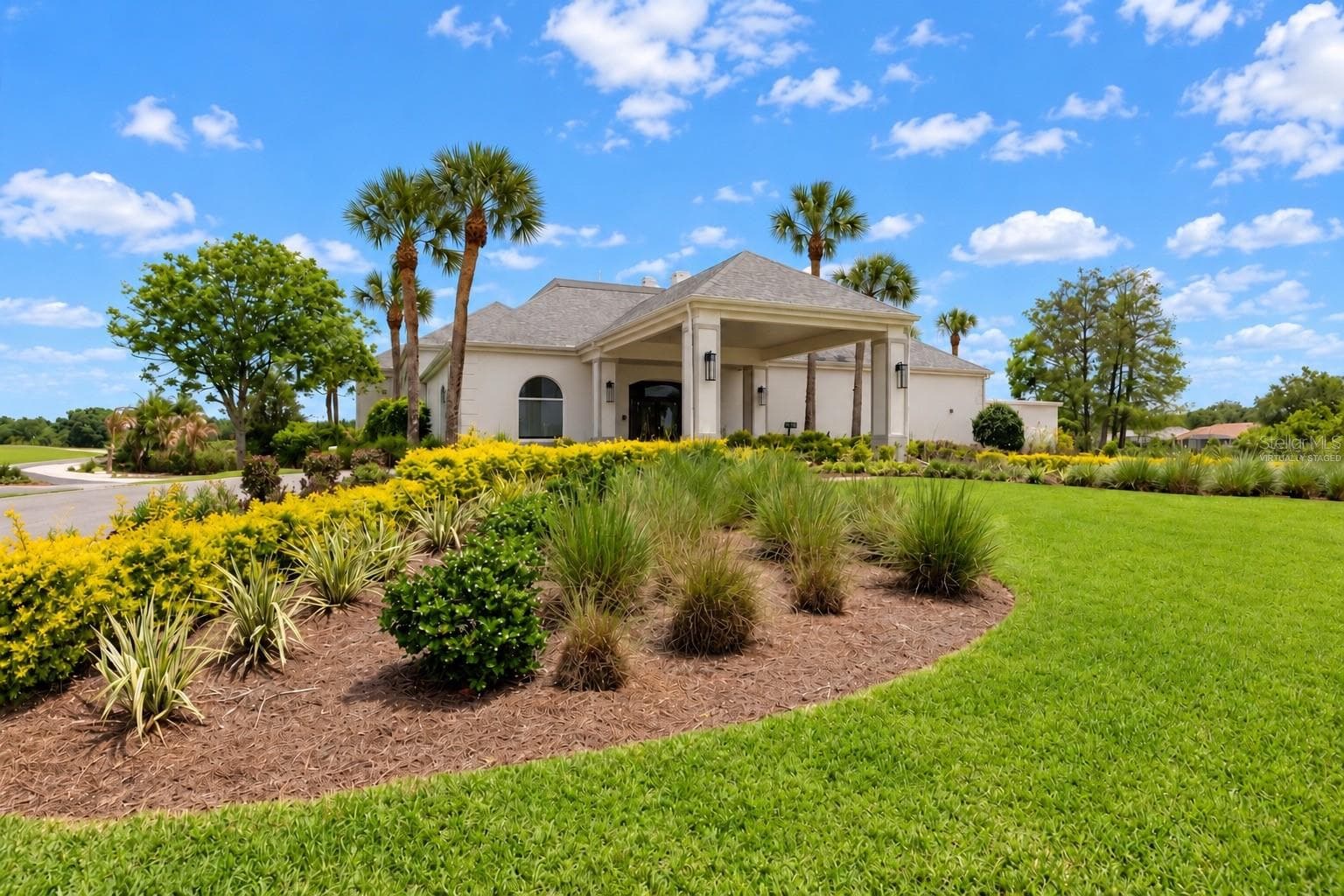 Clubhouse exterior, virtually staged, golf carts removed - 8309 MISTY LAKE CIR, SARASOTA