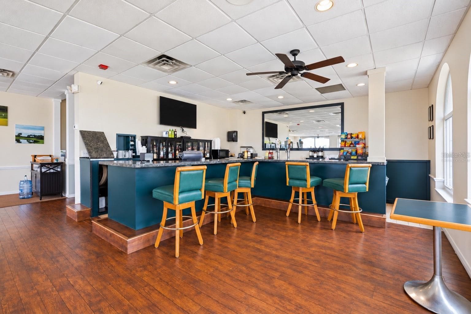 Clubhouse bar, virtually staged, table cleared and TV darkened - 8309 MISTY LAKE CIR, SARASOTA