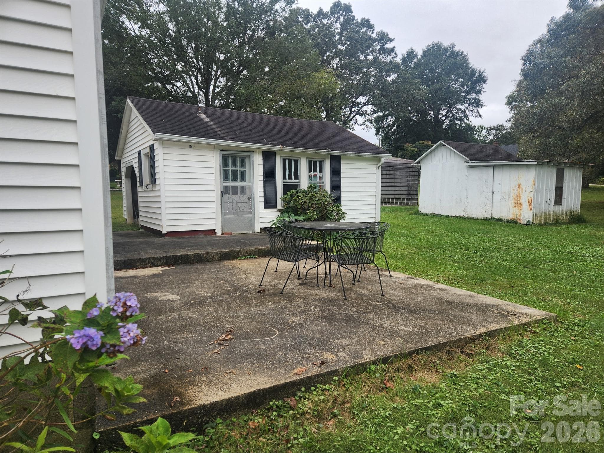 Patio and Laundry/Work Room. Also shows Outbuilding that will stay. - 1327 21st Street Street NE, Hickory
