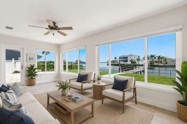 Virtually staged florida room - 12525 4TH ST E, TREASURE ISLAND