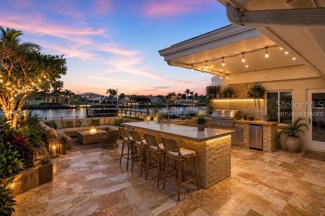 Virtually staged outdoor bar and kitchen - 12525 4TH ST E, TREASURE ISLAND