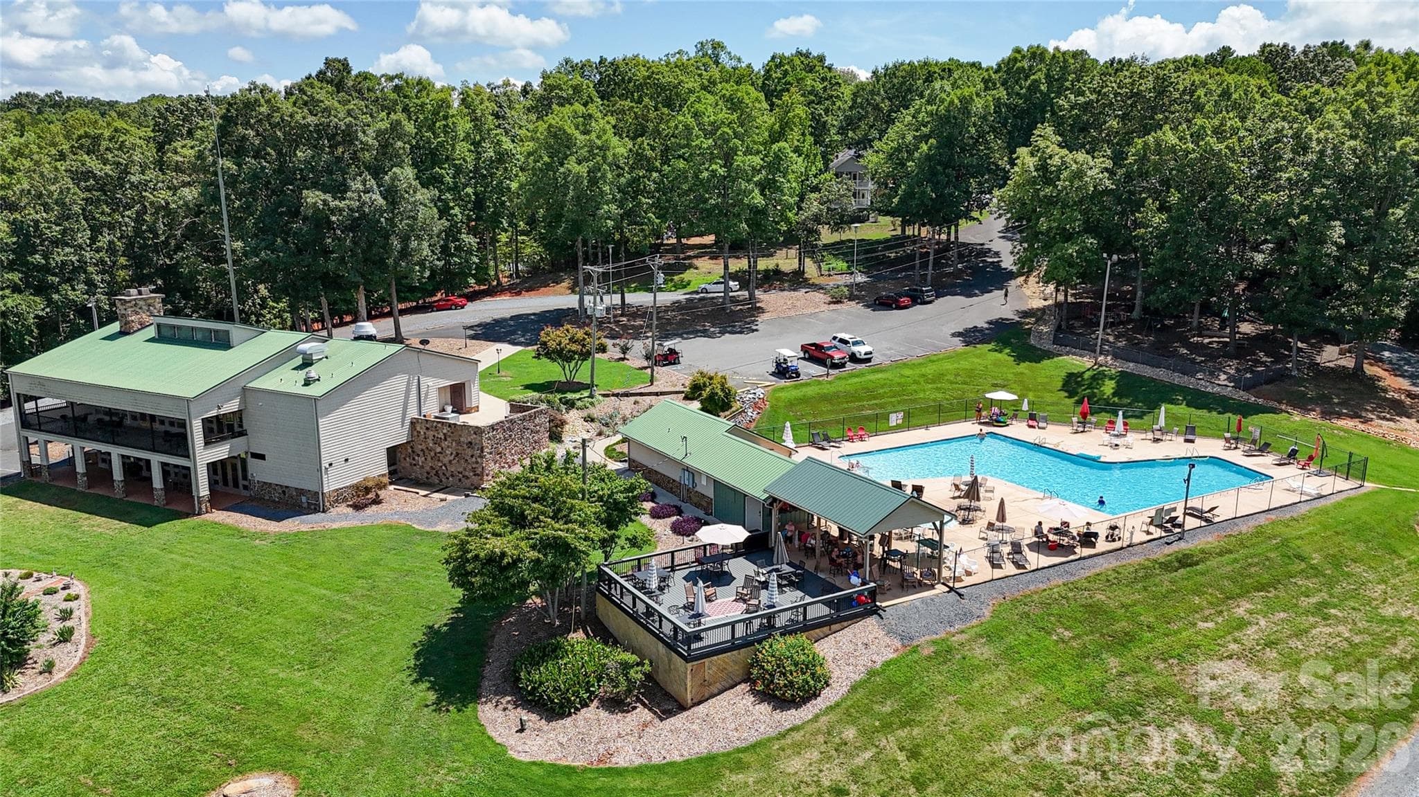 Woodrun Pool that features a covered area, snack shack and large uncovered deck for gatherings. - 571 Newport Drive, Mount Gilead