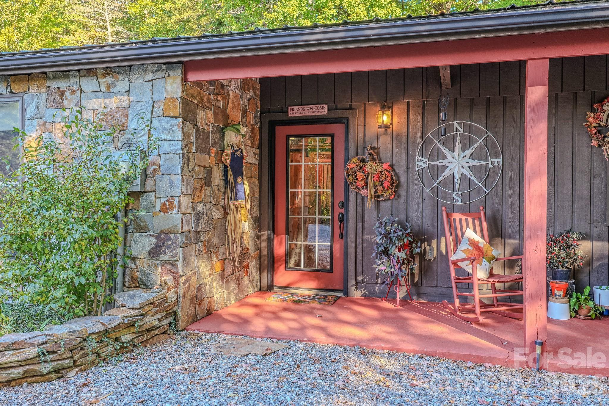 Covered front entry leads to a cozy great room with rustic mountain character, in Old Fort, NC. - 54 Winning Way, Old Fort