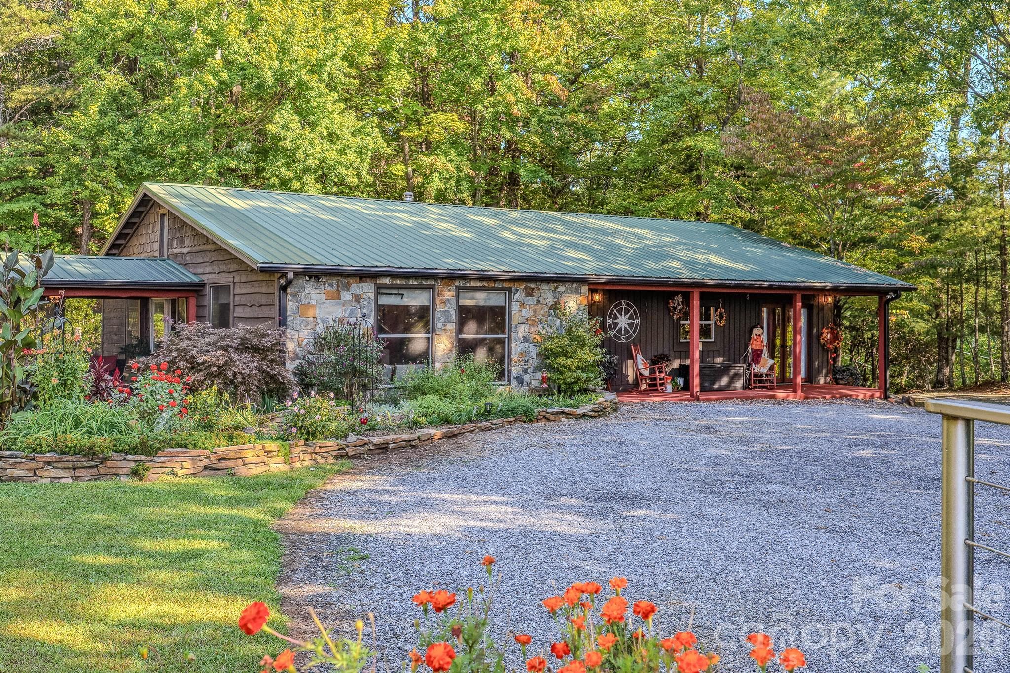 From the fairy garden to the fenced backyard to the observatory deck with long-range Lake Lure and mountain views, this Old Fort, NC home has it all. - 54 Winning Way, Old Fort