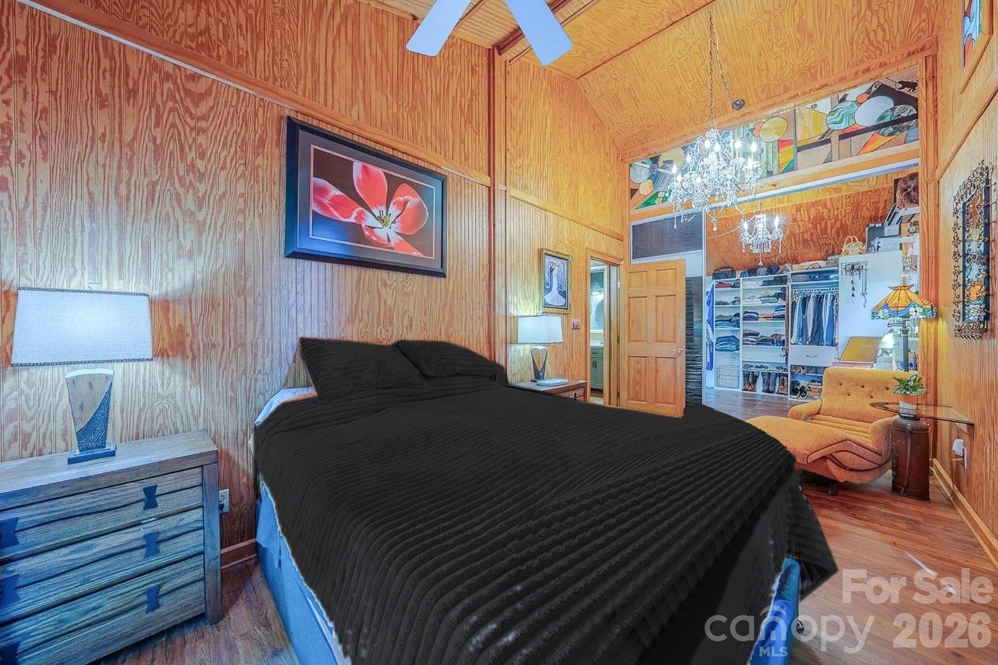 Retreat to a large bedroom with custom stained glass, vaulted wood ceilings, and a walk-through closet to an updated bathroom. - 54 Winning Way, Old Fort