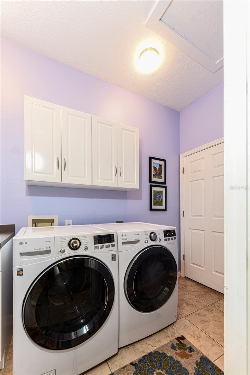 Interior laundry room on floor with living area. - 8049 TYBEE CT #8049, UNIVERSITY PARK