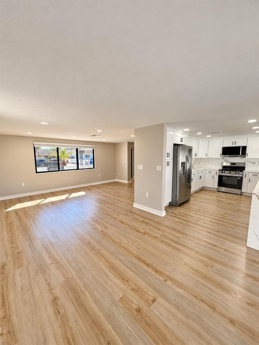 Open floor plan with huge kitchen - 5707 PERKIN DR, NEW PORT RICHEY