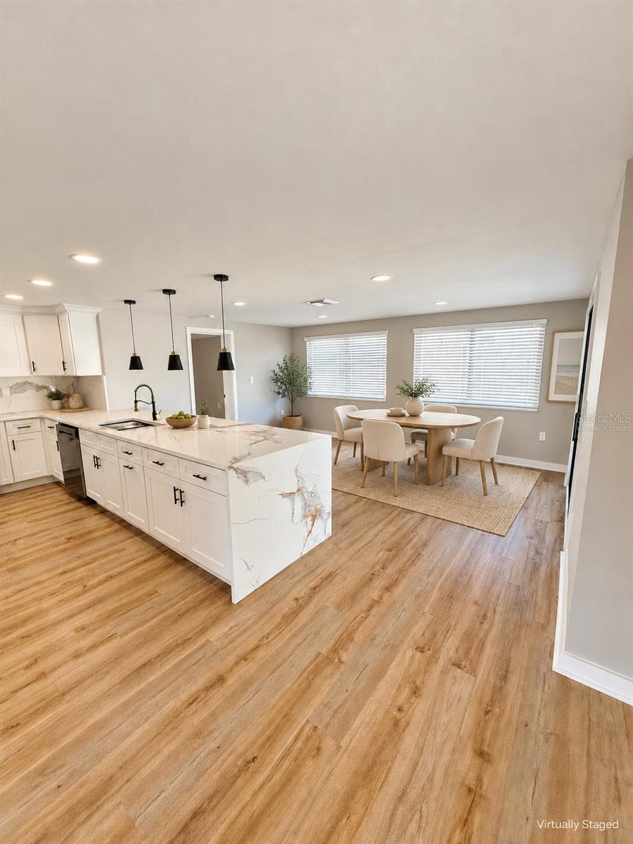 Kitchen and dining room virtually staged - 5707 PERKIN DR, NEW PORT RICHEY