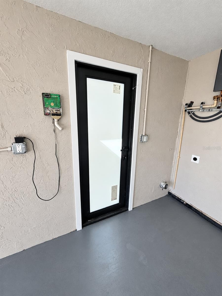 Graged door - 5707 PERKIN DR, NEW PORT RICHEY