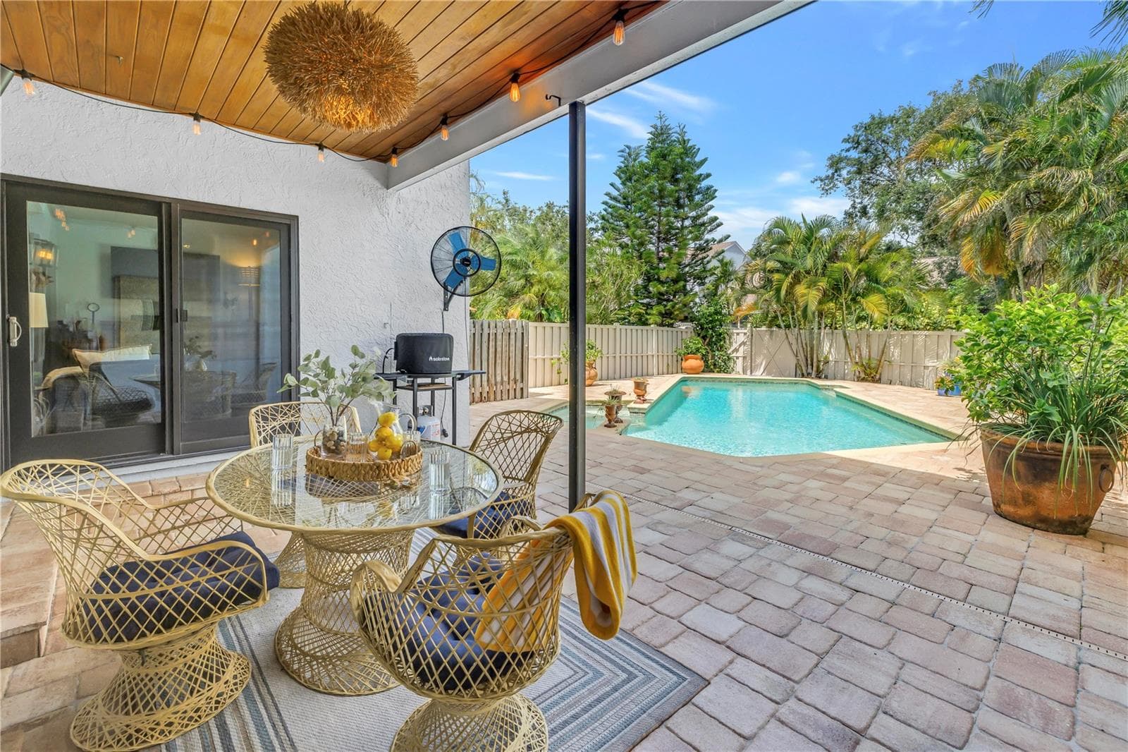 The pool is east-facing and receives afternoon shade, providing an ideal setting for a cool, shaded poolside cocktail hour. - 990 SAN CARLOS CT NE, ST PETERSBURG