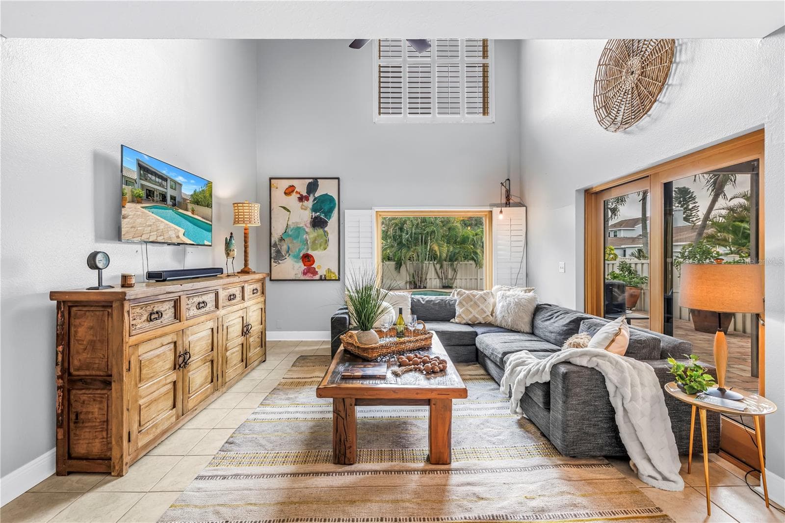 This expansive living area is perfect for entertaining and features impressive vaulted ceilings. Both Pella picture windows have been replaced. - 990 SAN CARLOS CT NE, ST PETERSBURG