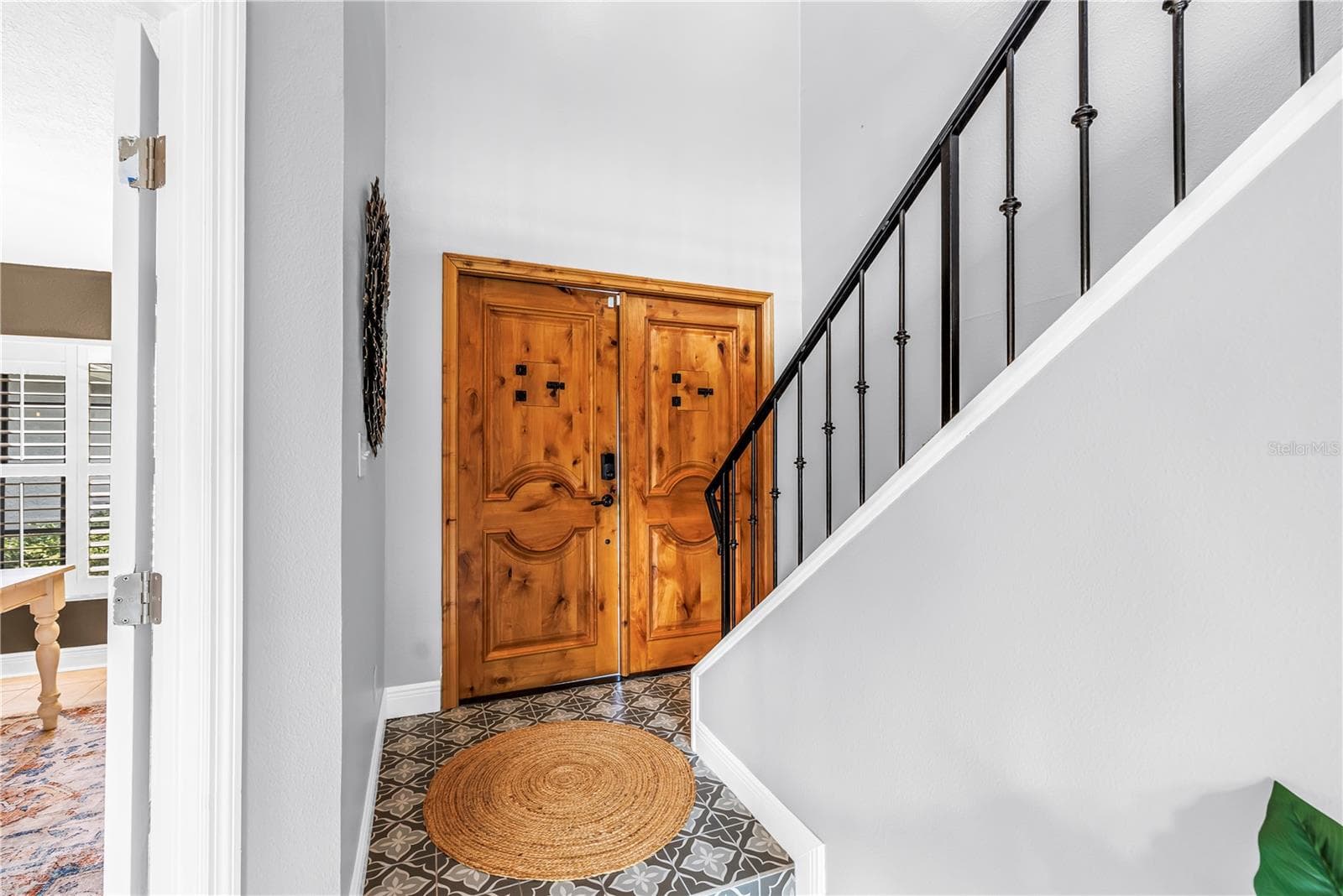 Custom double French front doors with notty Tuscan finish - 990 SAN CARLOS CT NE, ST PETERSBURG