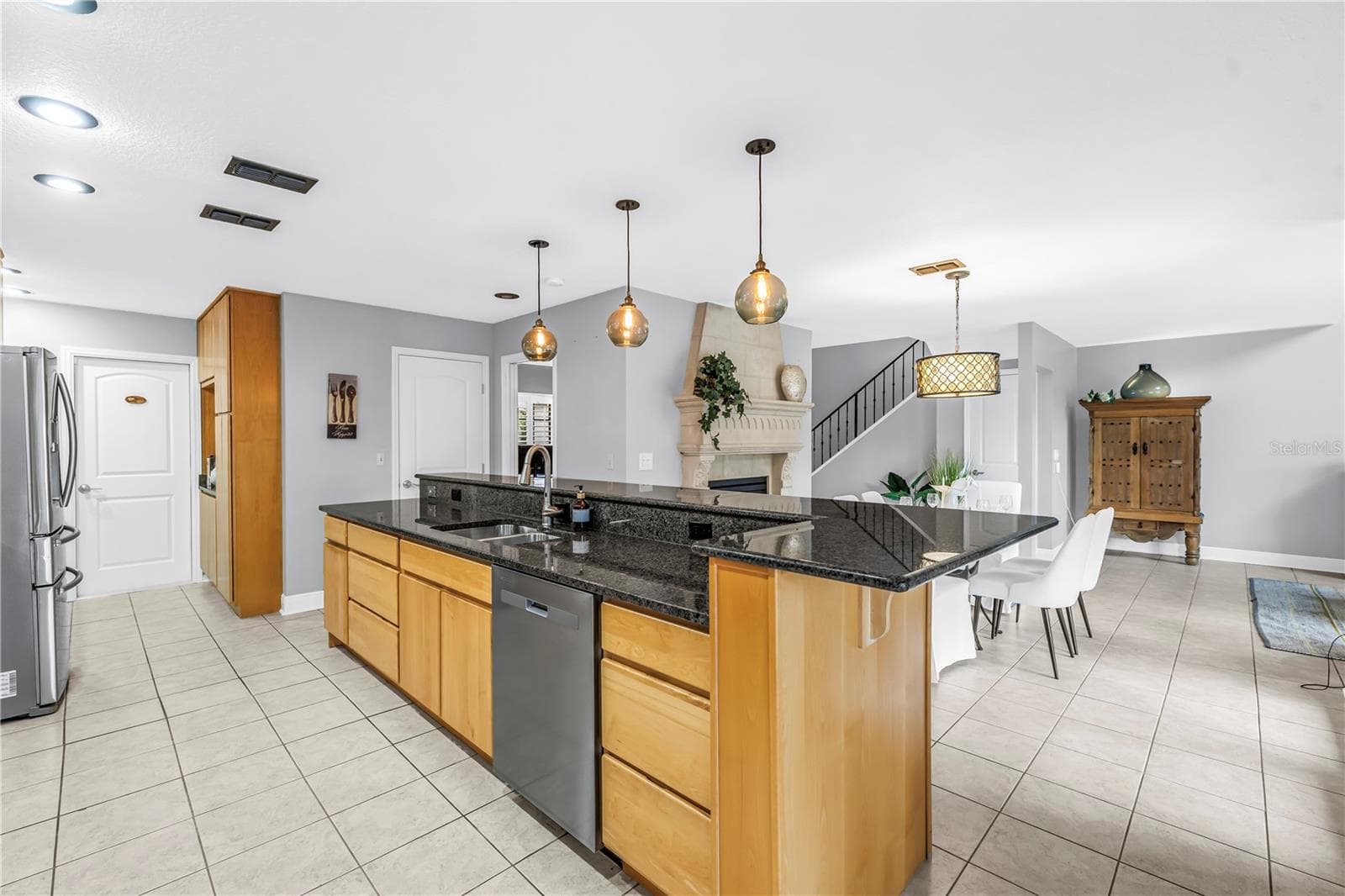 Great storage and an open feel in the kitchen with this long bar counter. - 990 SAN CARLOS CT NE, ST PETERSBURG