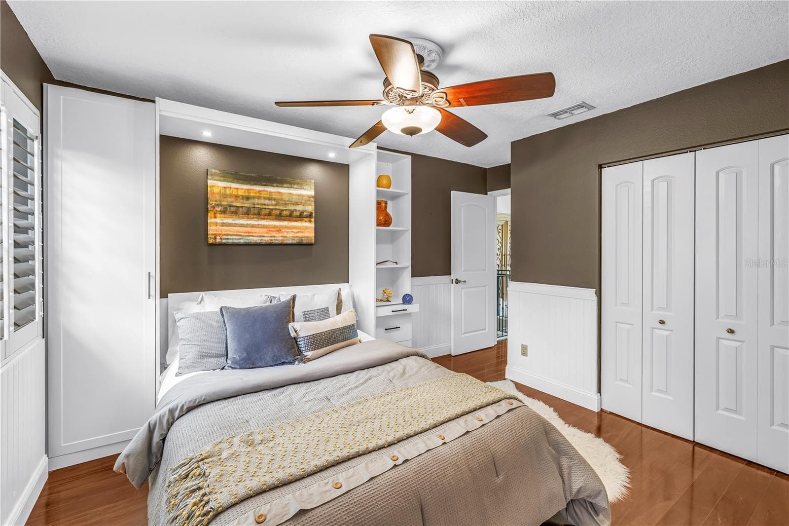 Upstairs Bedroom 2 has a murphy bed which conveys with the property. - 990 SAN CARLOS CT NE, ST PETERSBURG