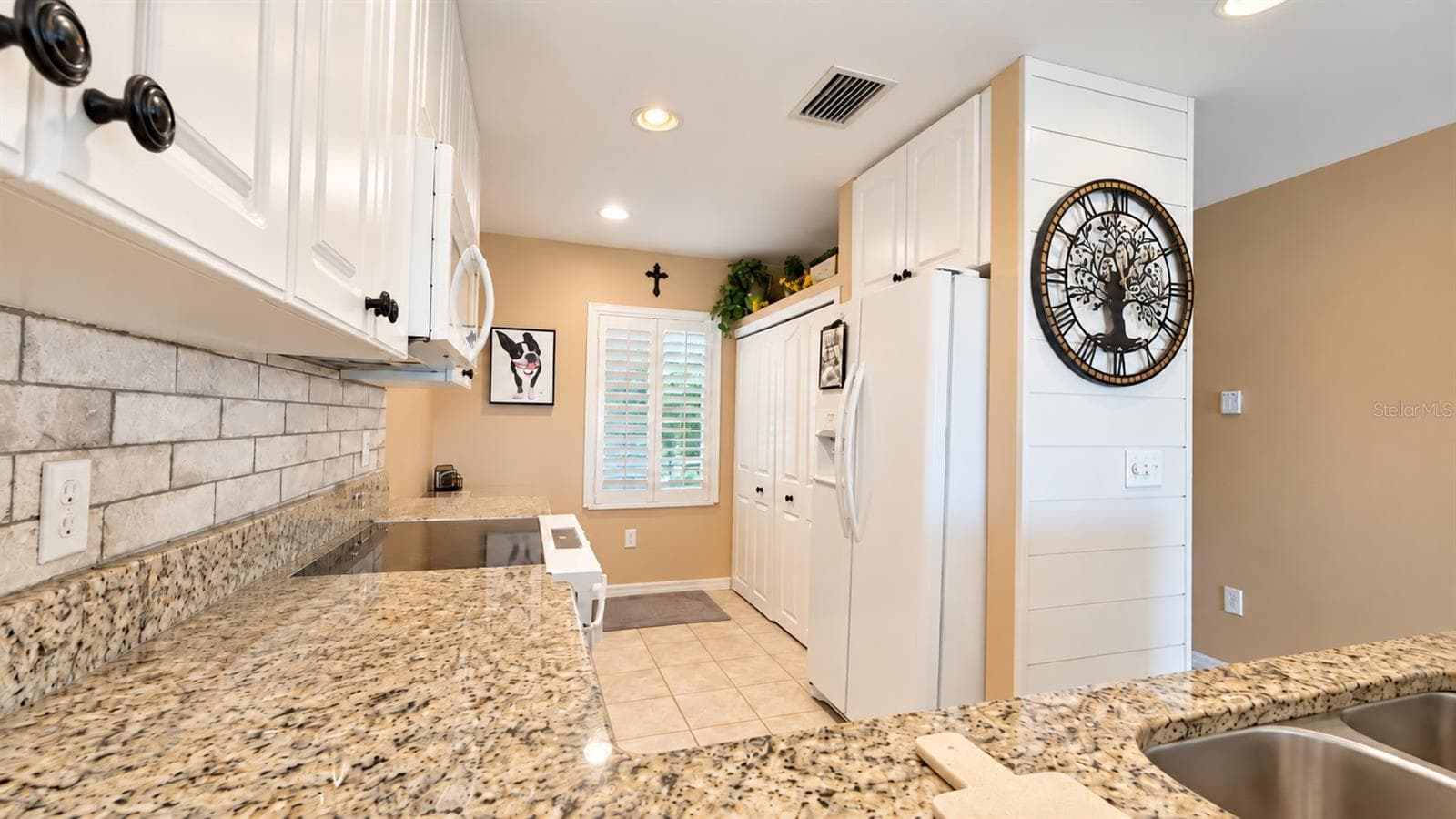 Double door pantry for storage. - 26397 NADIR RD #103, PUNTA GORDA