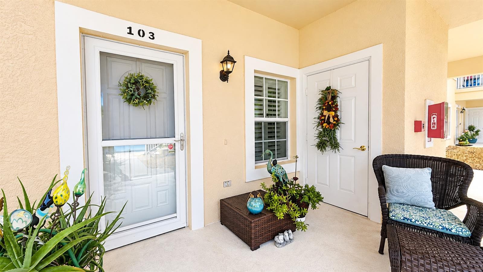 Front porch with large storage closet. - 26397 NADIR RD #103, PUNTA GORDA