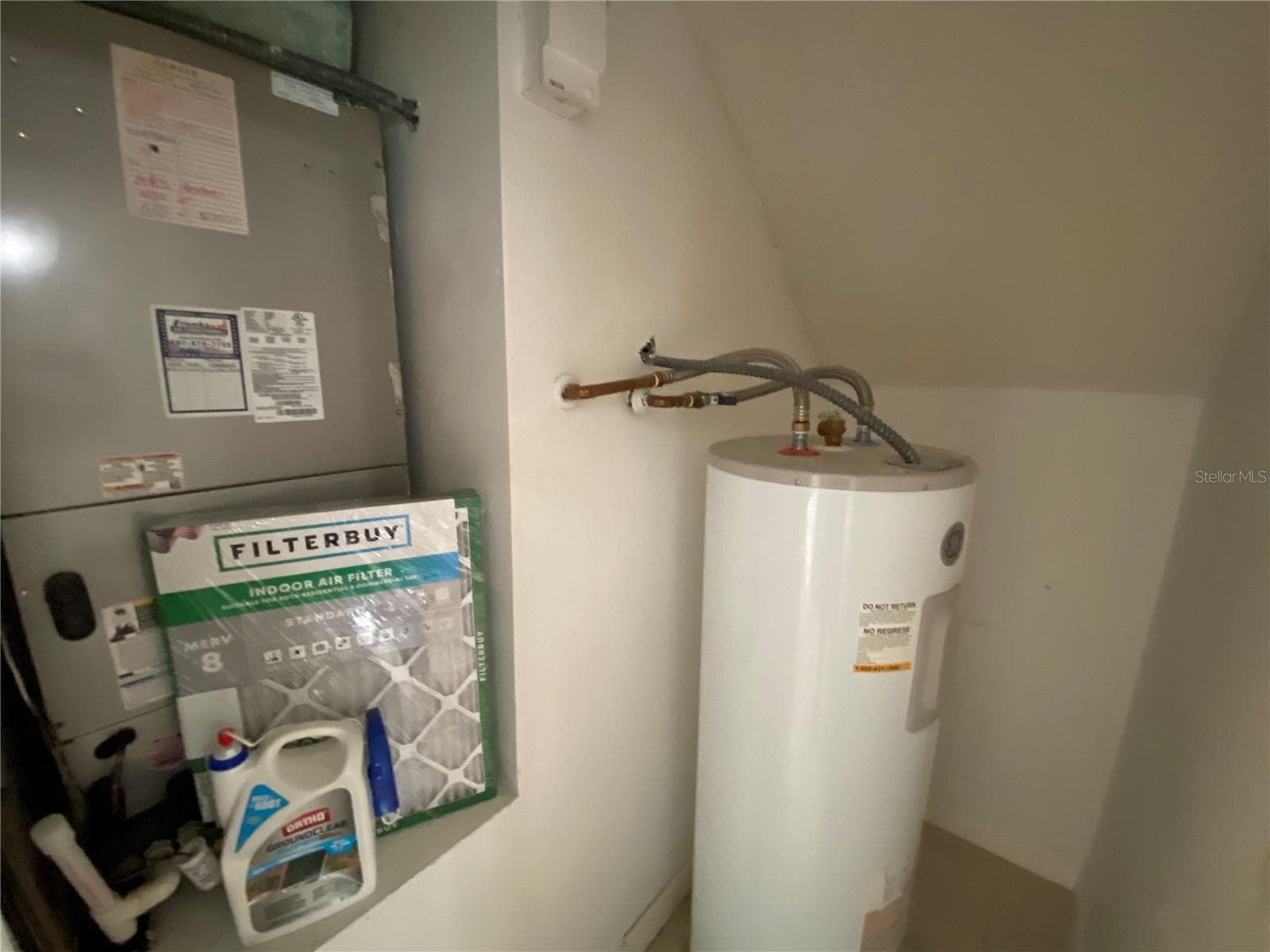 HVAC and Electric Water Heater under Stairway. - 82 LAKEPOINTE CIR #82, KISSIMMEE