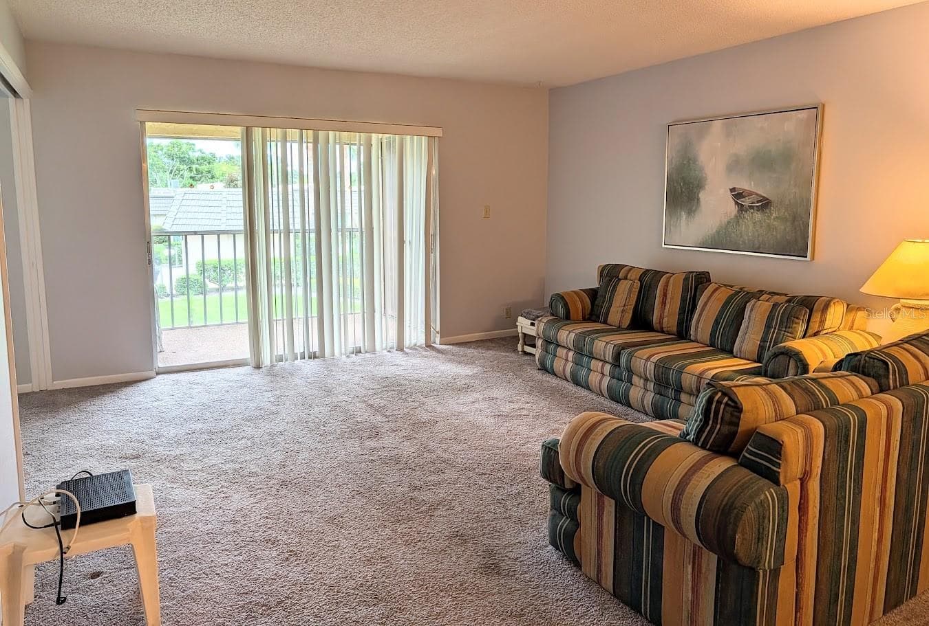 Living room with screened lanai / laundry - 8765 BARDMOOR BLVD #207, SEMINOLE
