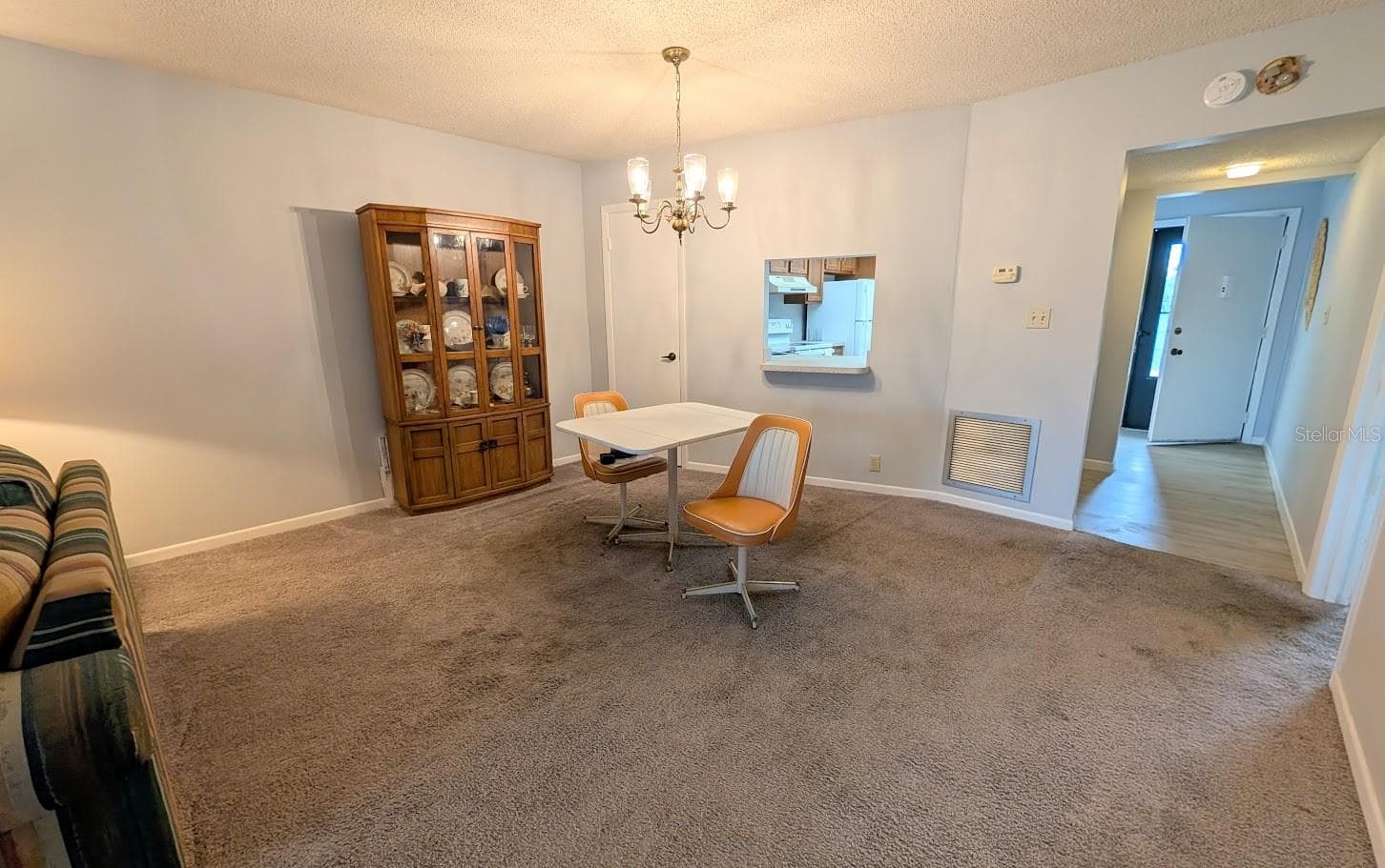 Dining area with pass through to kitchen - 8765 BARDMOOR BLVD #207, SEMINOLE