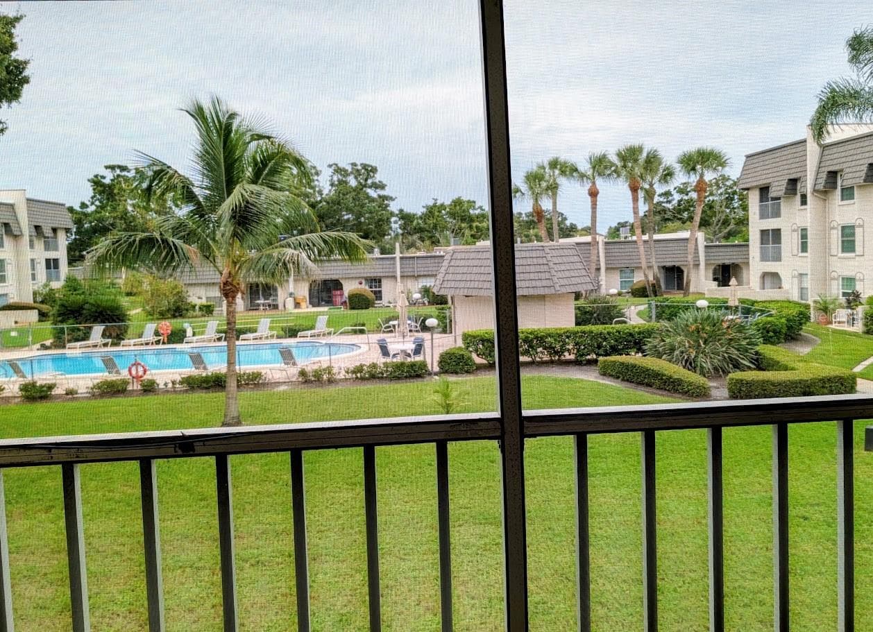 View of community pool area - 8765 BARDMOOR BLVD #207, SEMINOLE
