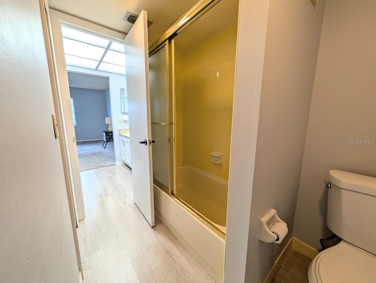 Primary bath area with tub shower - 8765 BARDMOOR BLVD #207, SEMINOLE