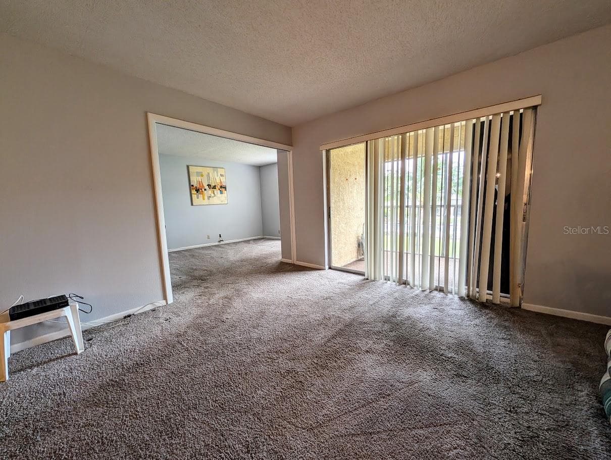 Entry to 2nd bedroom with open pocket door - 8765 BARDMOOR BLVD #207, SEMINOLE