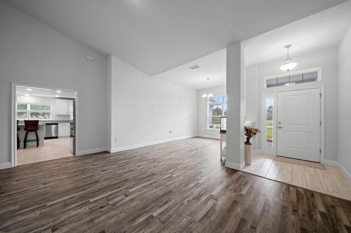 Front door and formal dining room - 140 NW 113TH CIR, OCALA