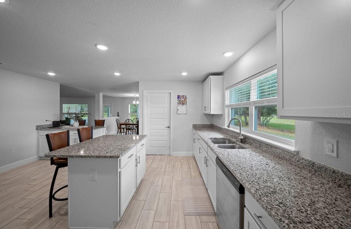 kitchen & pantry , Laundry room - 140 NW 113TH CIR, OCALA