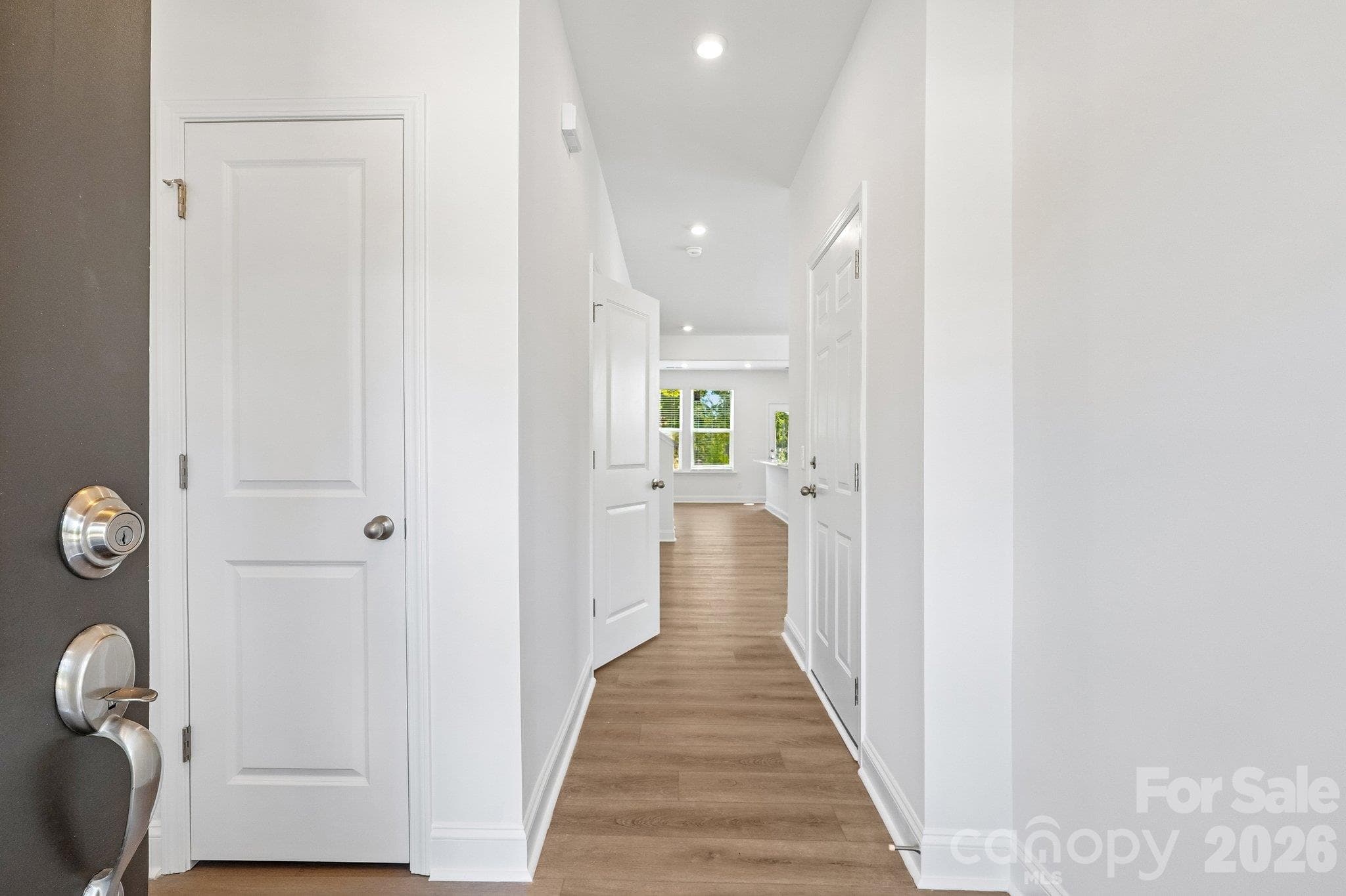 Welcoming entry hallway leads into the open living area. - Bell Glen, Charlotte